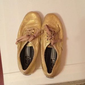 Gold metallic meds tennis shoes